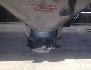 Closeup detail of a carbon black industry railcar.